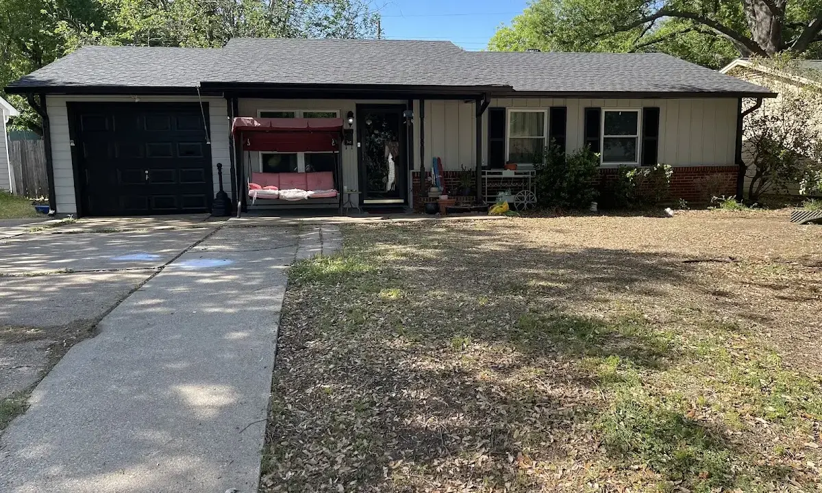 Asphalt Shingle Roof Repair crew at work on a residential roof in Havelock